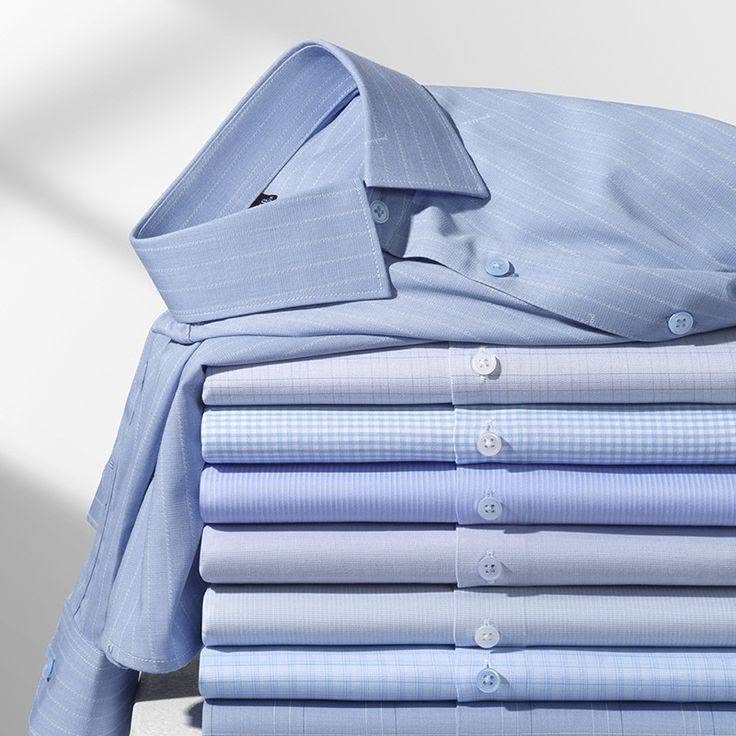 May đồng phục công sở TPHCM: bộ sơ mi - chân váy - vest cho doanh nghiệp 11 chồng áo sơ mi xanh nhạt sọc caro gấp catalog — may đồng phục công sở đa dạng mẫu